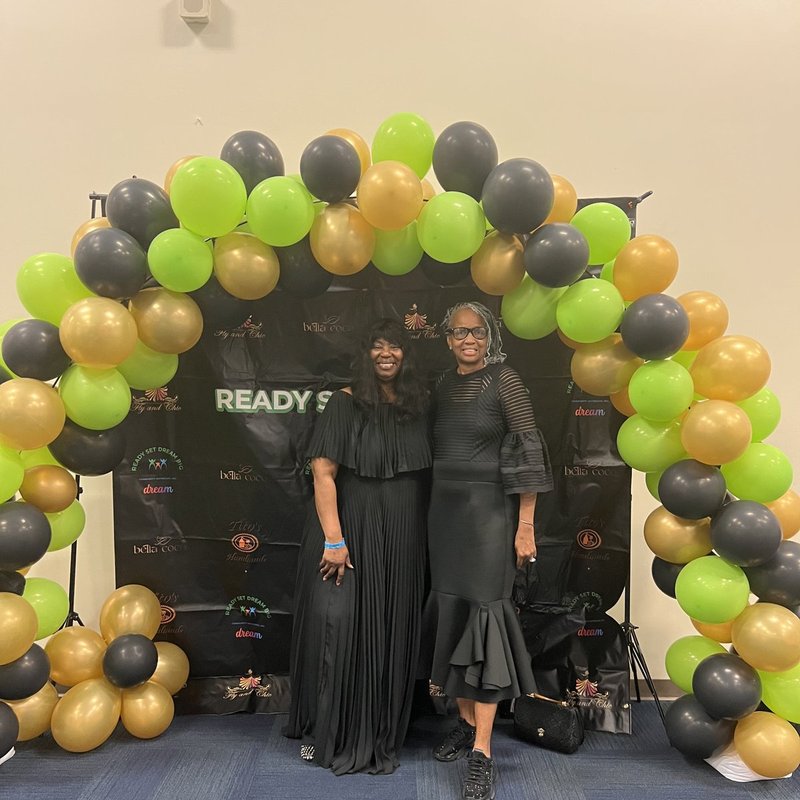 Guest at the Women Who Make It Happen gala backdrop
